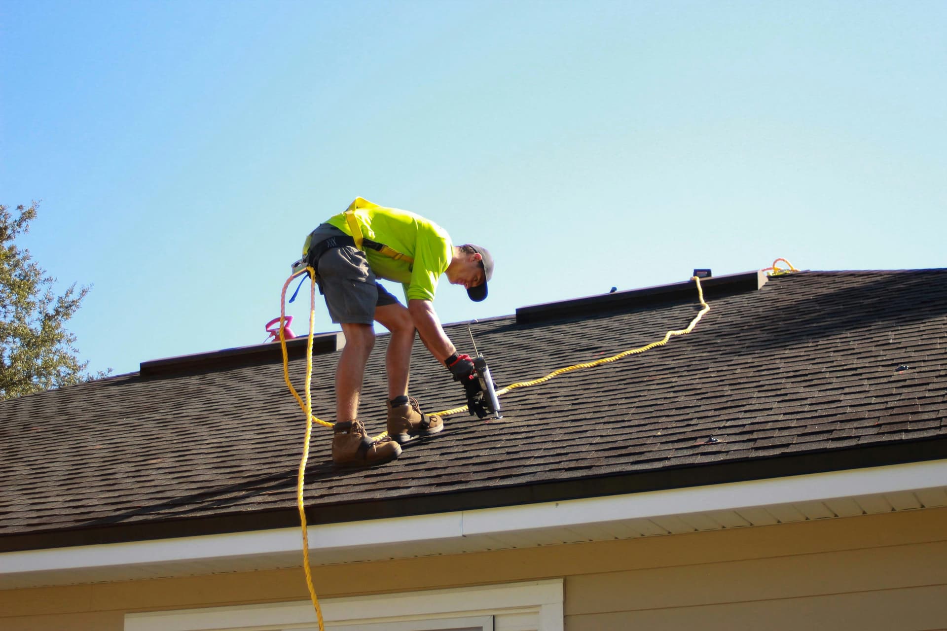 Roofer inspecting storm damage